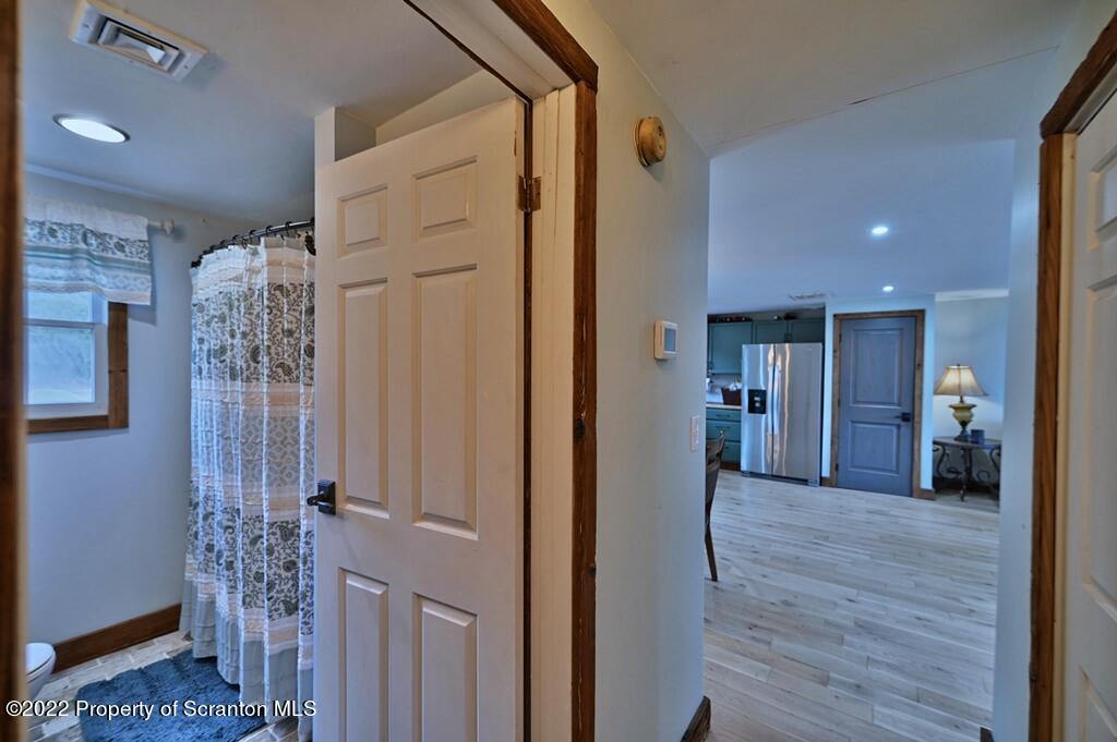 22 Suetta Lane Moscow, PA 18444 - Photo 14 of 53 a view of a hallway with a livingroom and a chandelier