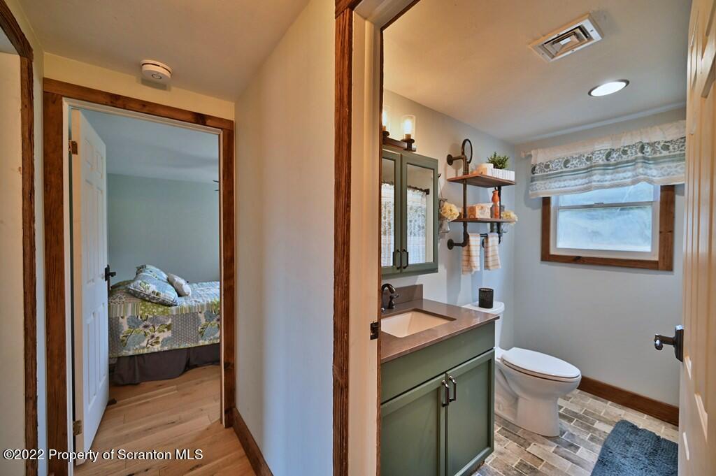 22 Suetta Lane Moscow, PA 18444 - Photo 15 of 53 a bathroom with a sink a toilet and shower