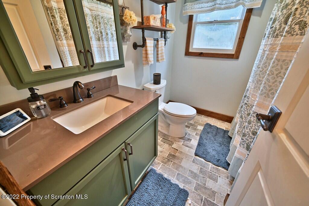 22 Suetta Lane Moscow, PA 18444 - Photo 17 of 53 a bathroom with a sink and a mirror