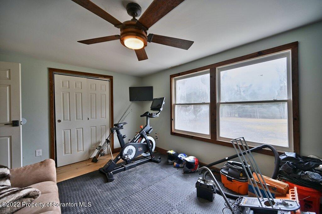 22 Suetta Lane Moscow, PA 18444 - Photo 21 of 53 a room with gym equipment and windows