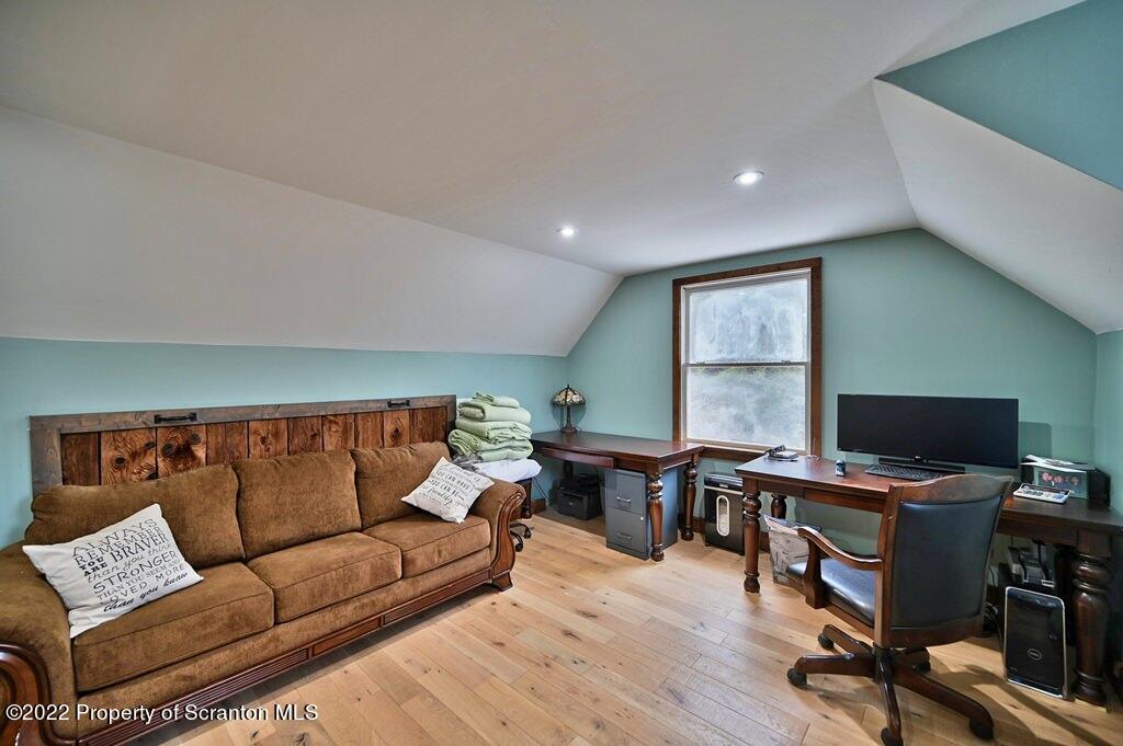 22 Suetta Lane Moscow, PA 18444 - Photo 25 of 53 a living room with furniture and a wooden floor