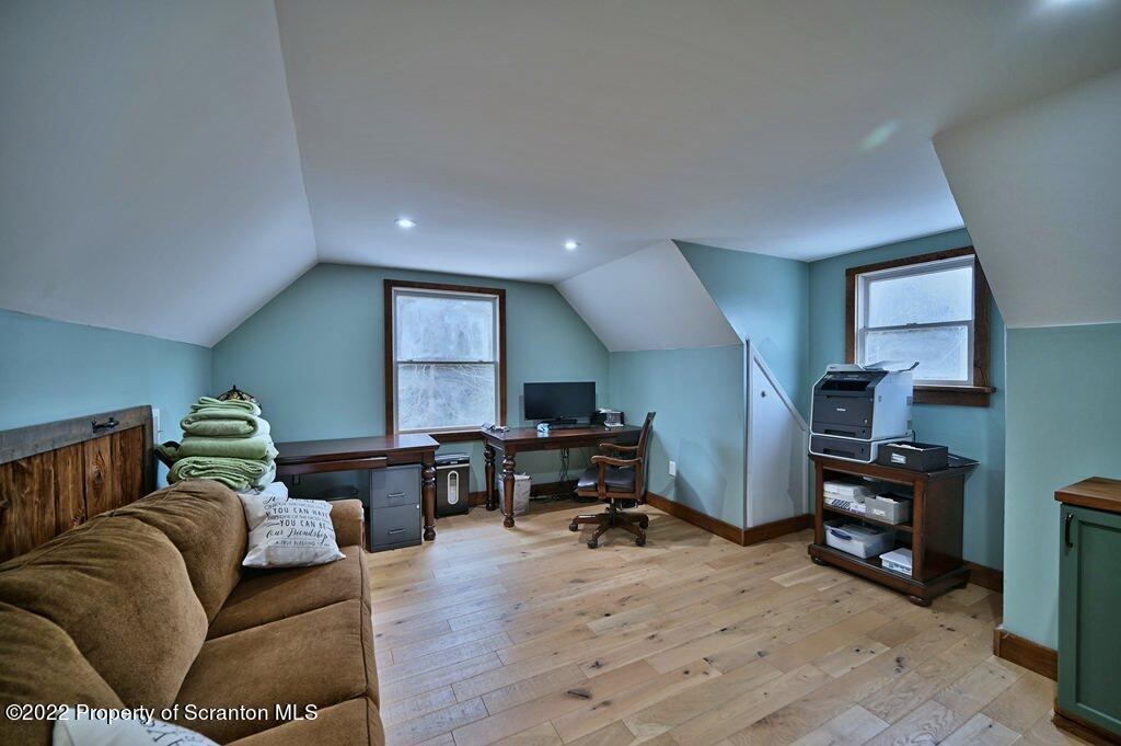 22 Suetta Lane Moscow, PA 18444 - Photo 27 of 53 a living room with furniture and a flat screen tv