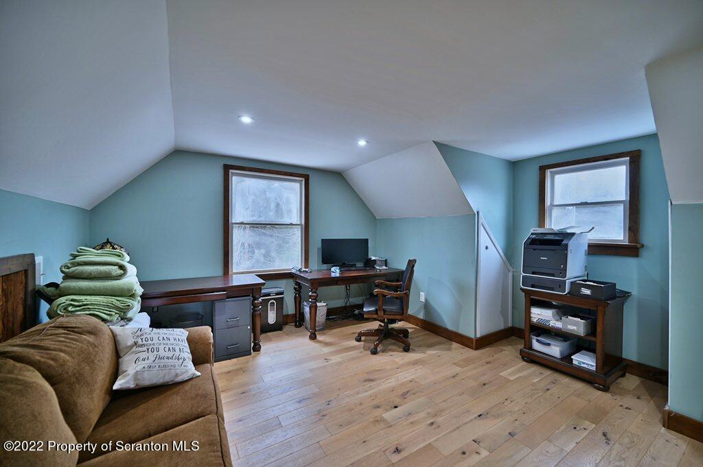22 Suetta Lane Moscow, PA 18444 - Photo 28 of 53 a living room with furniture and a wooden floor