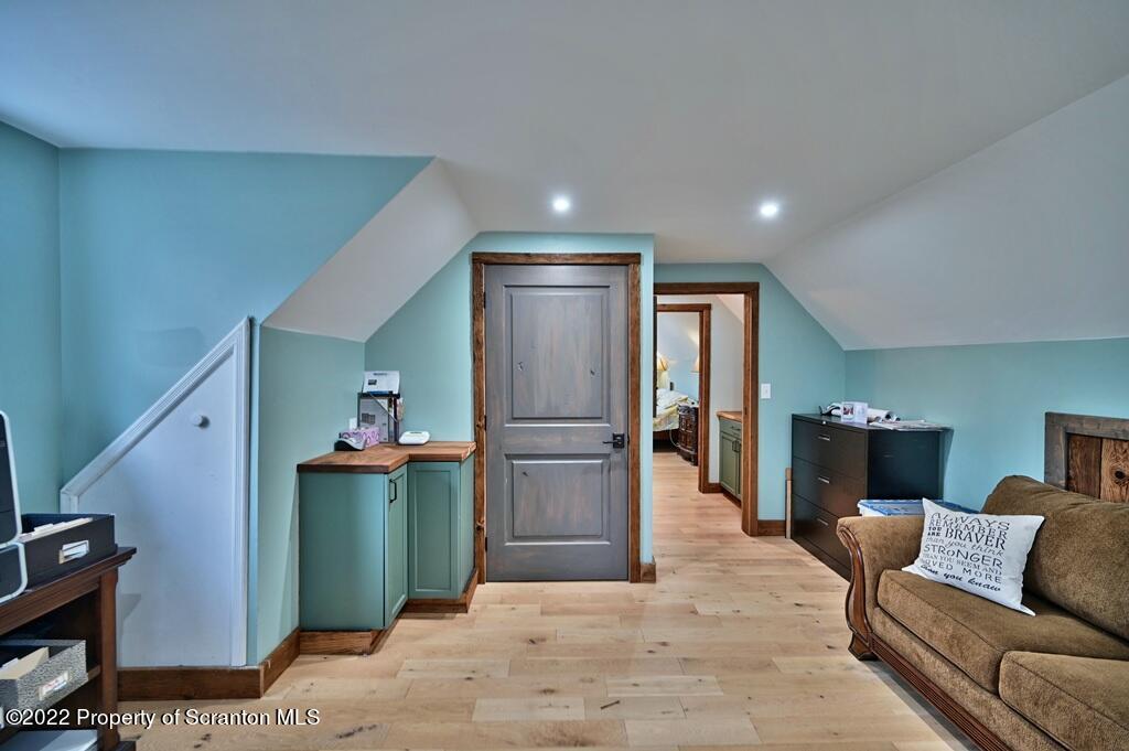 22 Suetta Lane Moscow, PA 18444 - Photo 30 of 53 a living room with furniture and a wooden floor