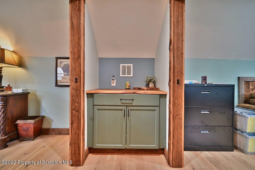 22 Suetta Lane Moscow, PA 18444 - Photo 32 of 53 a room with a bed and a mirror