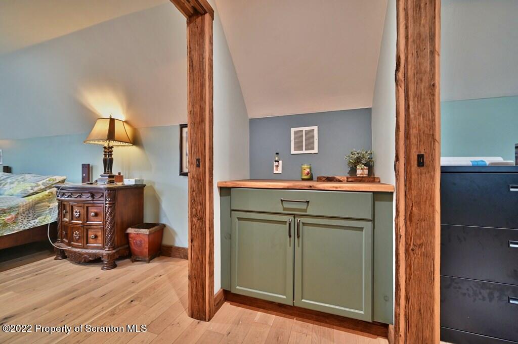22 Suetta Lane Moscow, PA 18444 - Photo 33 of 53 a room with a bed and a mirror