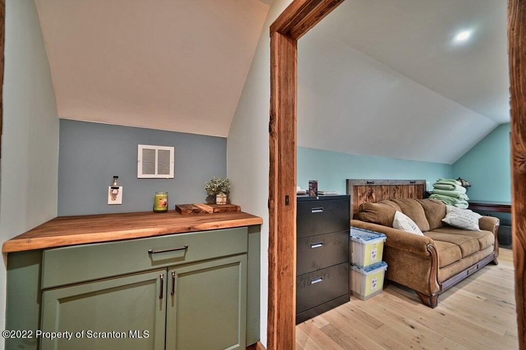 22 Suetta Lane Moscow, PA 18444 - Photo 34 of 53 a bedroom with a bed and wooden floor
