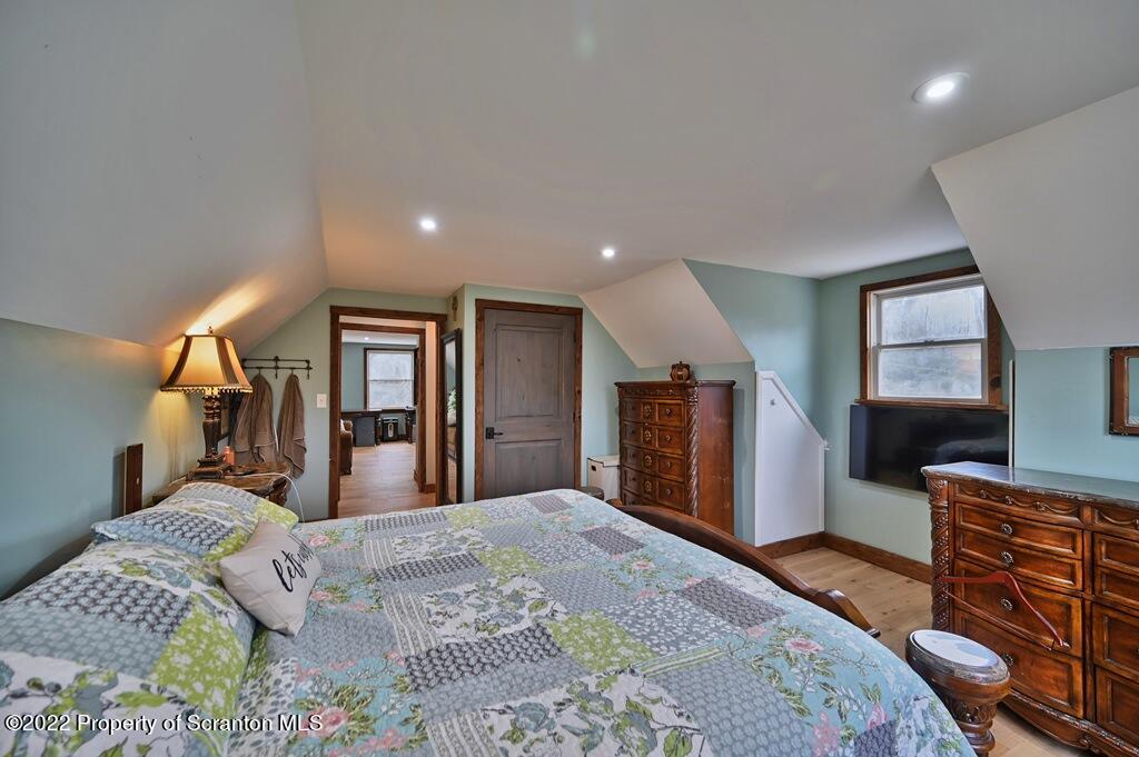 22 Suetta Lane Moscow, PA 18444 - Photo 39 of 53 a bedroom with a bed and a flat screen television