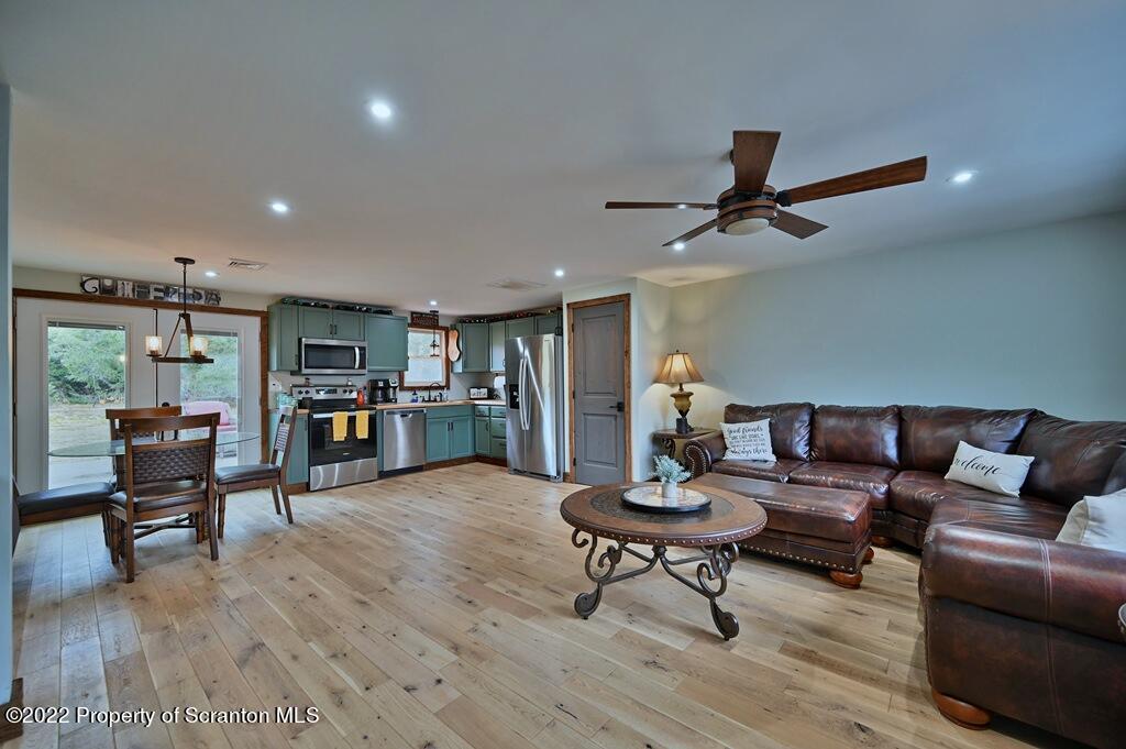 22 Suetta Lane Moscow, PA 18444 - Photo 3 of 53 a living room with furniture and a wooden floor