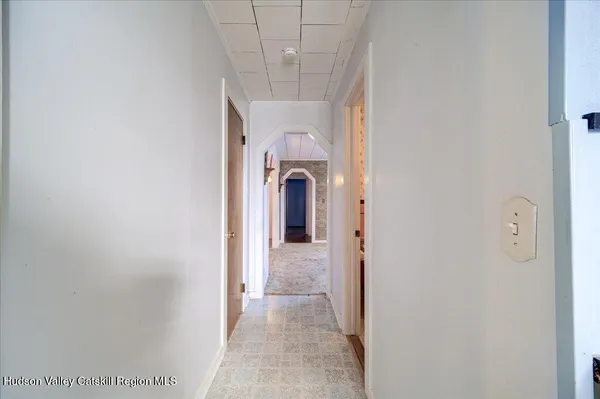 a view of a hallway with a chandelier