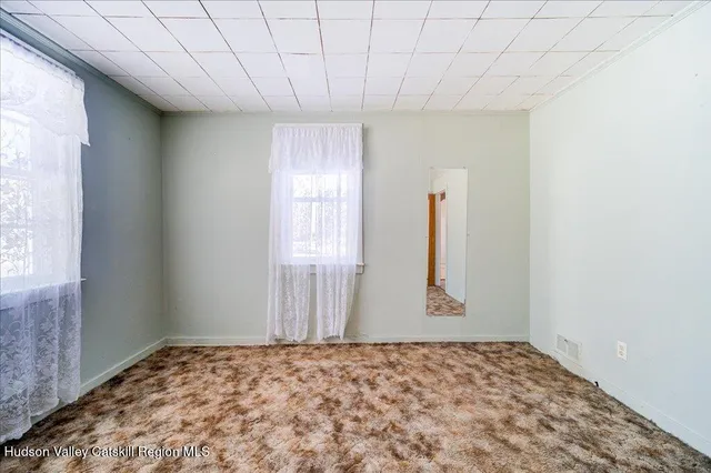 a room with furniture and stairs