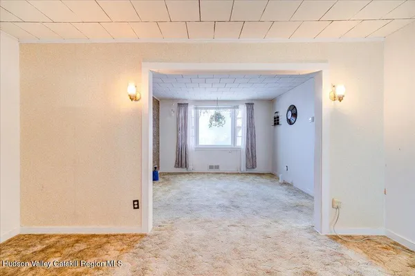 a view of an empty room and window