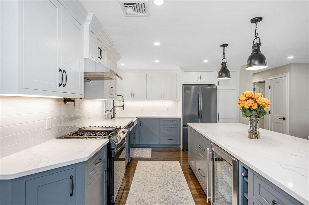 3 Gregory Road Chelmsford, MA 01824 - Photo 6 of 42 a kitchen with stainless steel appliances a sink stove and cabinets