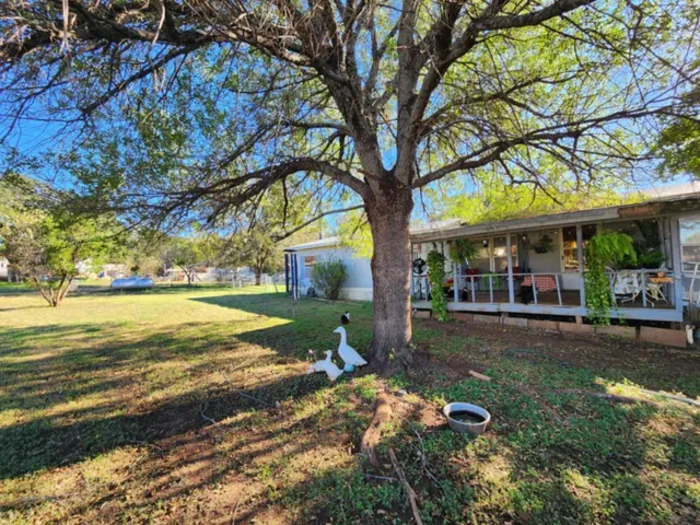 a view of a building with a yard