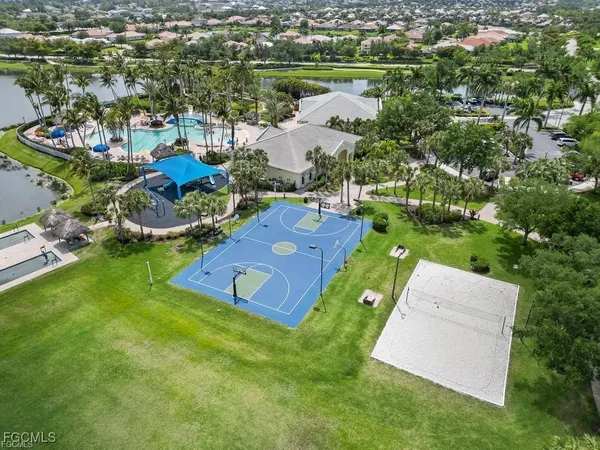 an aerial view of a house with a garden and lake view