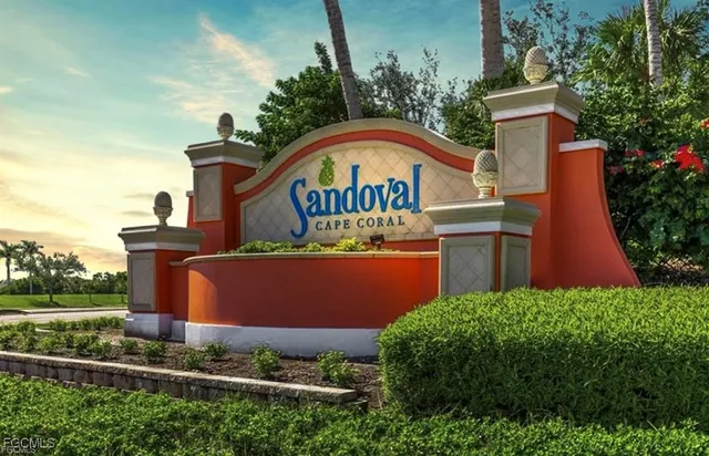 an aerial view of a house with garden space and street view