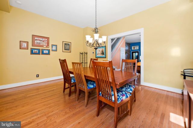 a bathroom with a toilet a sink and a mirror