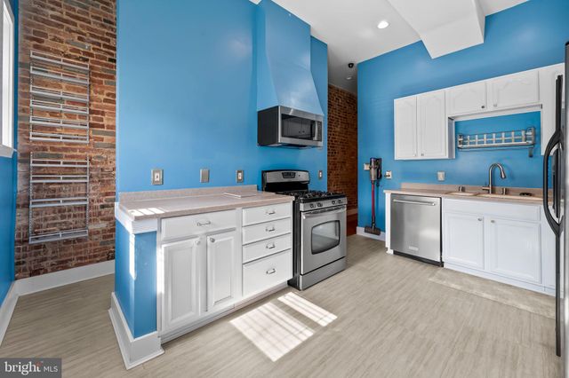 a kitchen with a stove and a microwave