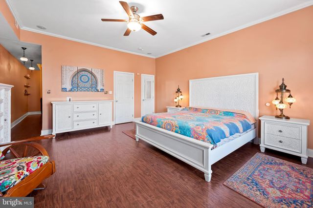 a bed room with a bed and a tv