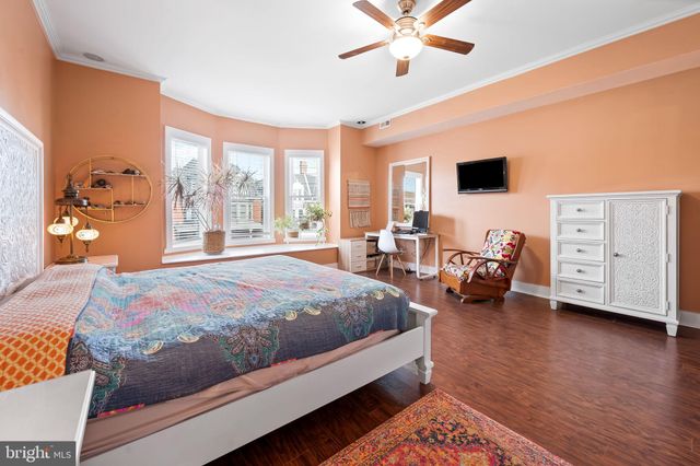 a view of walk in closet with clothes