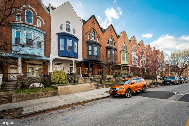 a car parked in front of a building