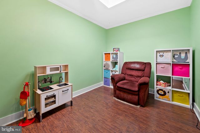 a view of a livingroom with furniture and storage