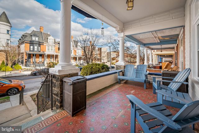 a outdoor space with the couches and dining table