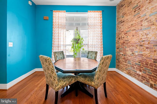 a view of a dining room with furniture and window