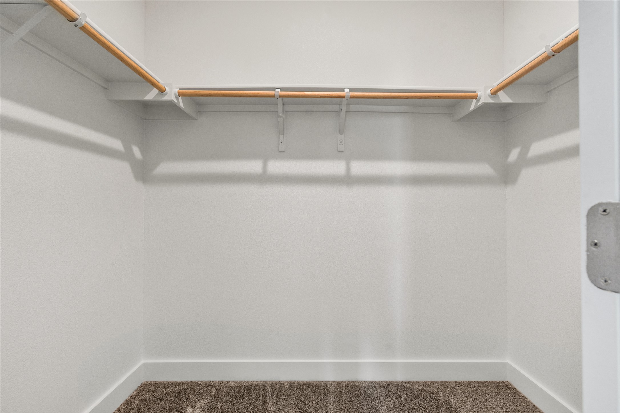 8500 Red Bottle Brush Road Lago Vista, TX 78645 - Photo 22 of 33 Ample hanging space and shelving offer convenient organization in this well-appointed closet.