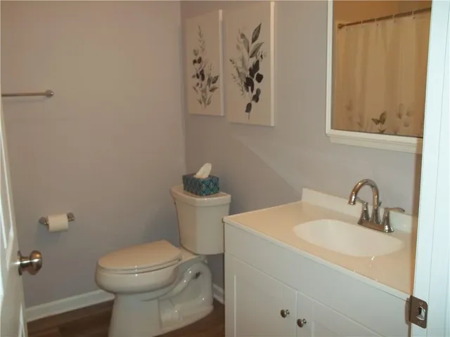 a bathroom with a toilet and sink