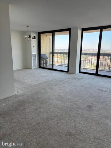 a view of a hallway to rooms