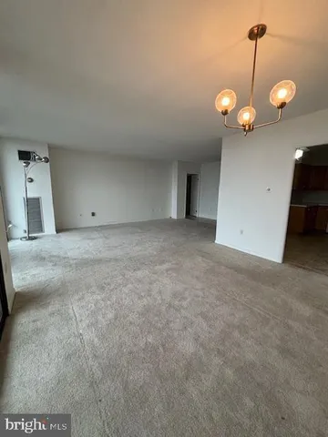 a bathroom with a sink a toilet a mirror and shower