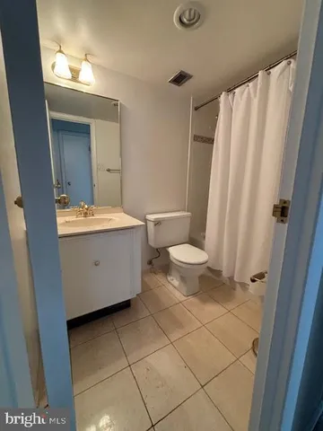 a view of an empty room with a fireplace