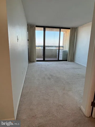 view of a room with a sink and mirror