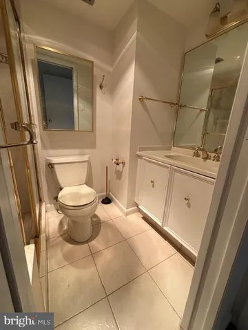 a view of a room with a sink and mirror