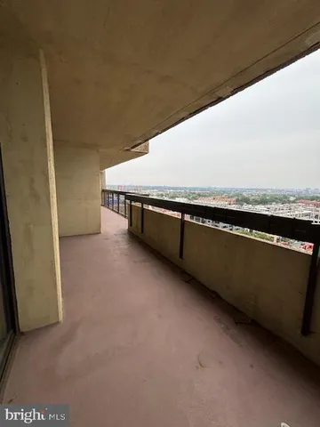 a view of a living room and chandelier