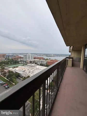 a very nice looking room with wooden floor and furniture