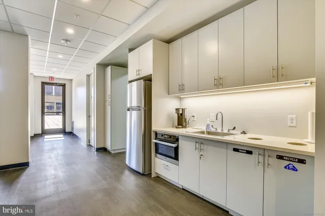 a view of a balcony with an outdoor seating