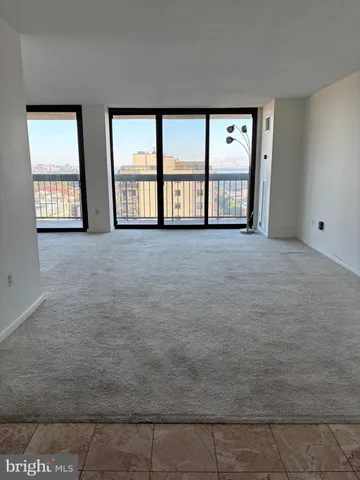 a kitchen with a sink and a refrigerator