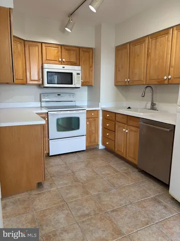 an empty room with closet and a window