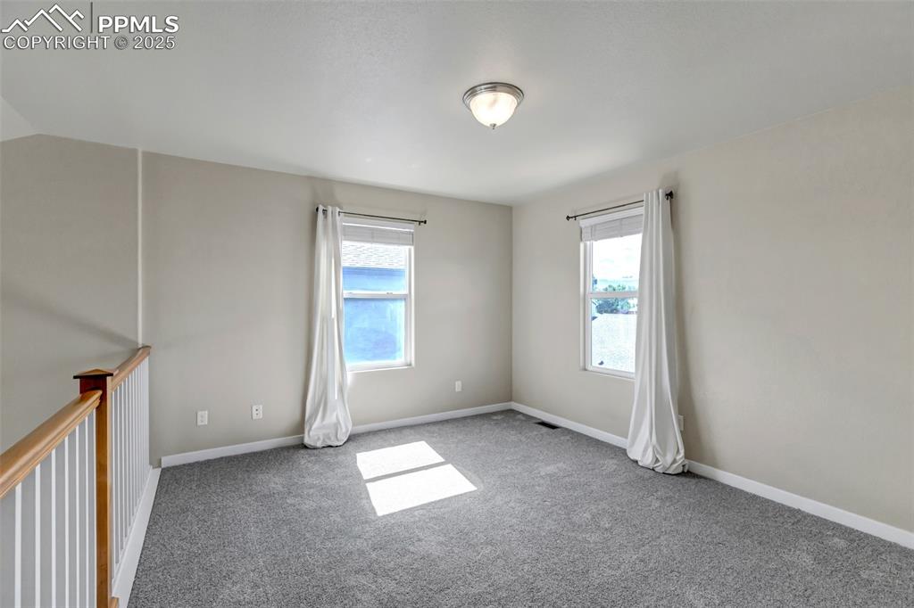 1822 Bulrush Way Colorado Springs, CO 80915 - Photo 28 of 37 an empty room with windows