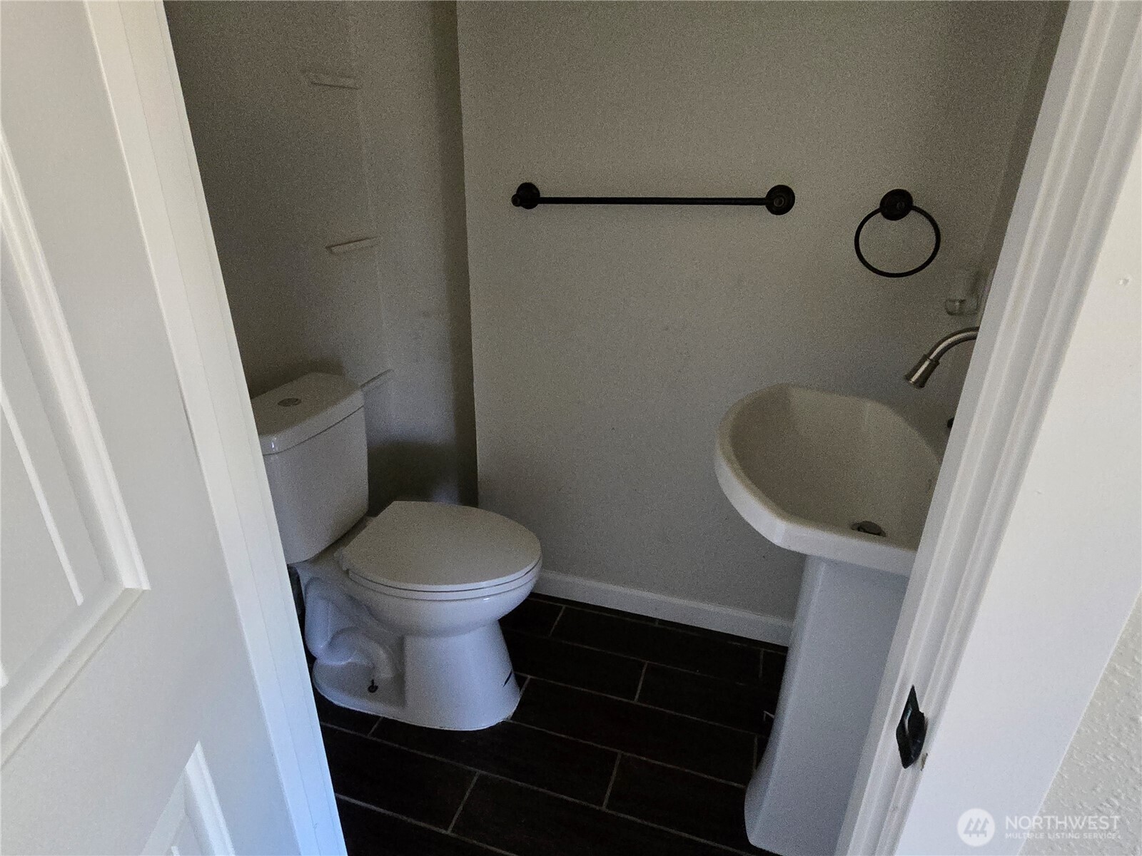 8405 24th Avenue Southwest Seattle, WA 98106 - Photo 11 of 14 a bathroom with a toilet and a sink