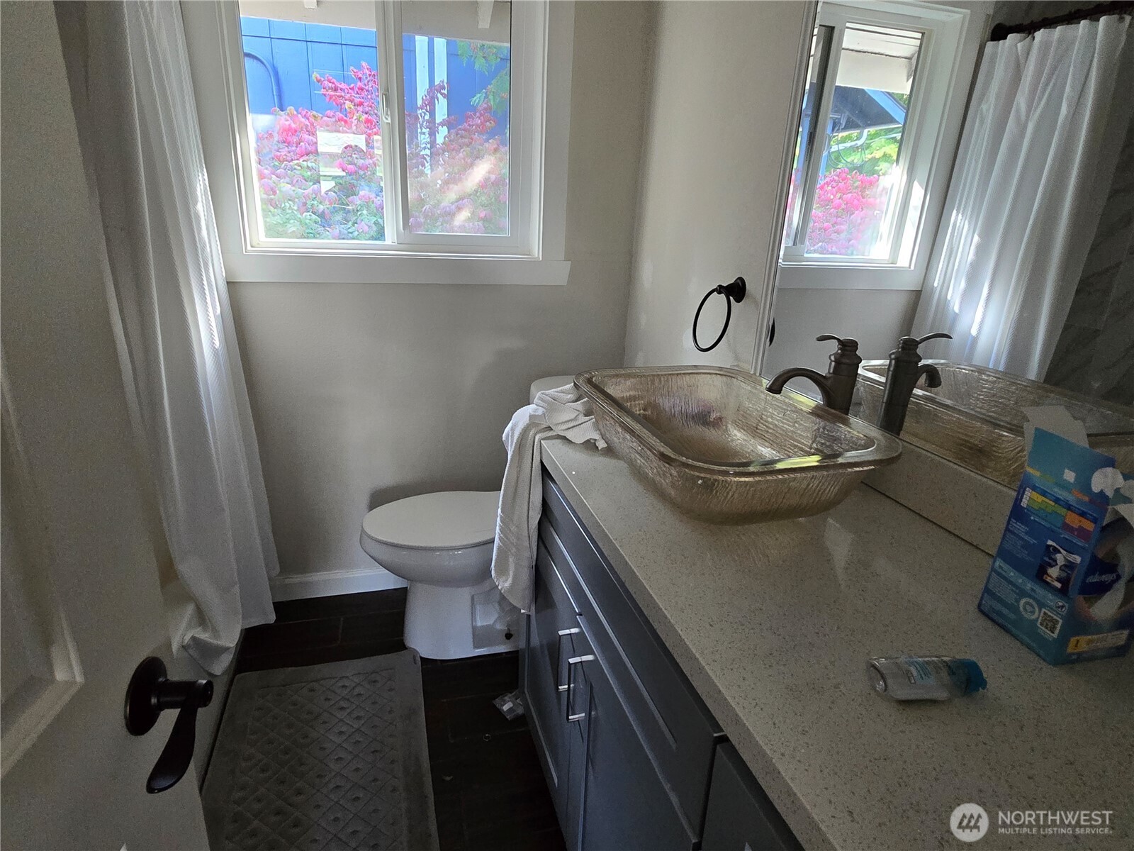 8405 24th Avenue Southwest Seattle, WA 98106 - Photo 12 of 14 a bathroom with a sink toilet and a mirror