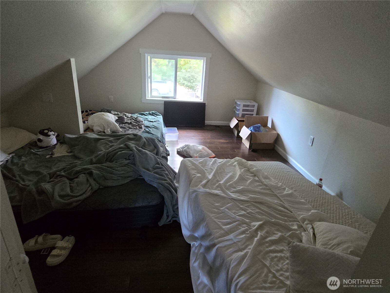 8405 24th Avenue Southwest Seattle, WA 98106 - Photo 4 of 14 a bedroom with a bed and a window