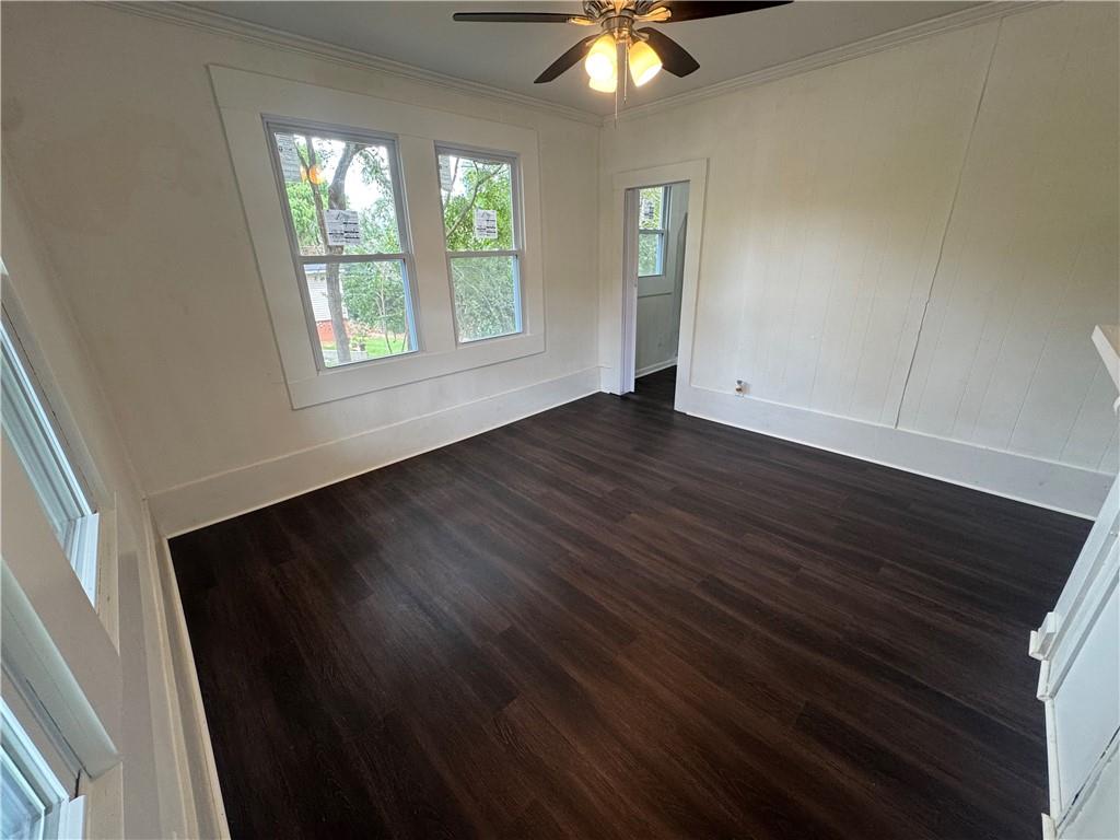 24 Lower Street Valley, AL 36854 - Photo 4 of 18 Empty room with crown molding and dark wood-type flooring