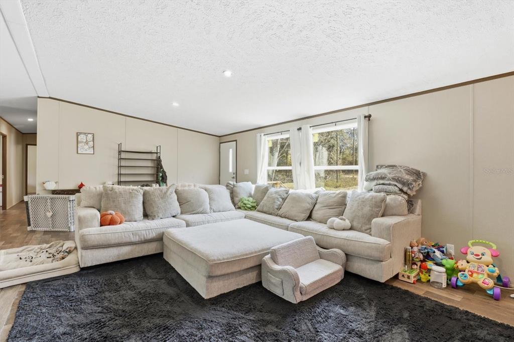 7290 Northeast 110th Avenue Bronson, FL 32621 - Photo 13 of 46 a living room with furniture and a window
