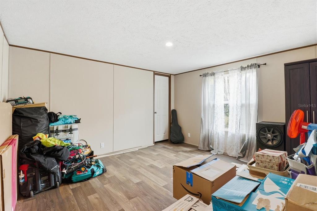 7290 Northeast 110th Avenue Bronson, FL 32621 - Photo 28 of 46 a room with toys and wooden floor