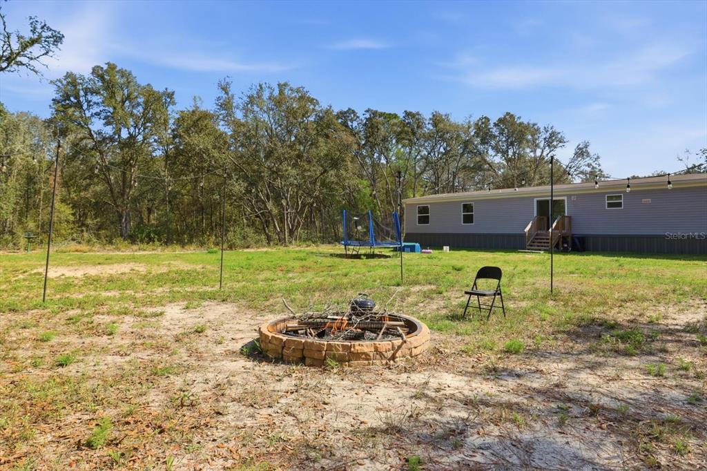 7290 Northeast 110th Avenue Bronson, FL 32621 - Photo 33 of 46 a view of a backyard with a garden
