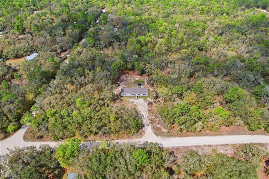7290 Northeast 110th Avenue Bronson, FL 32621 - Photo 39 of 46 an aerial view of residential house with green space