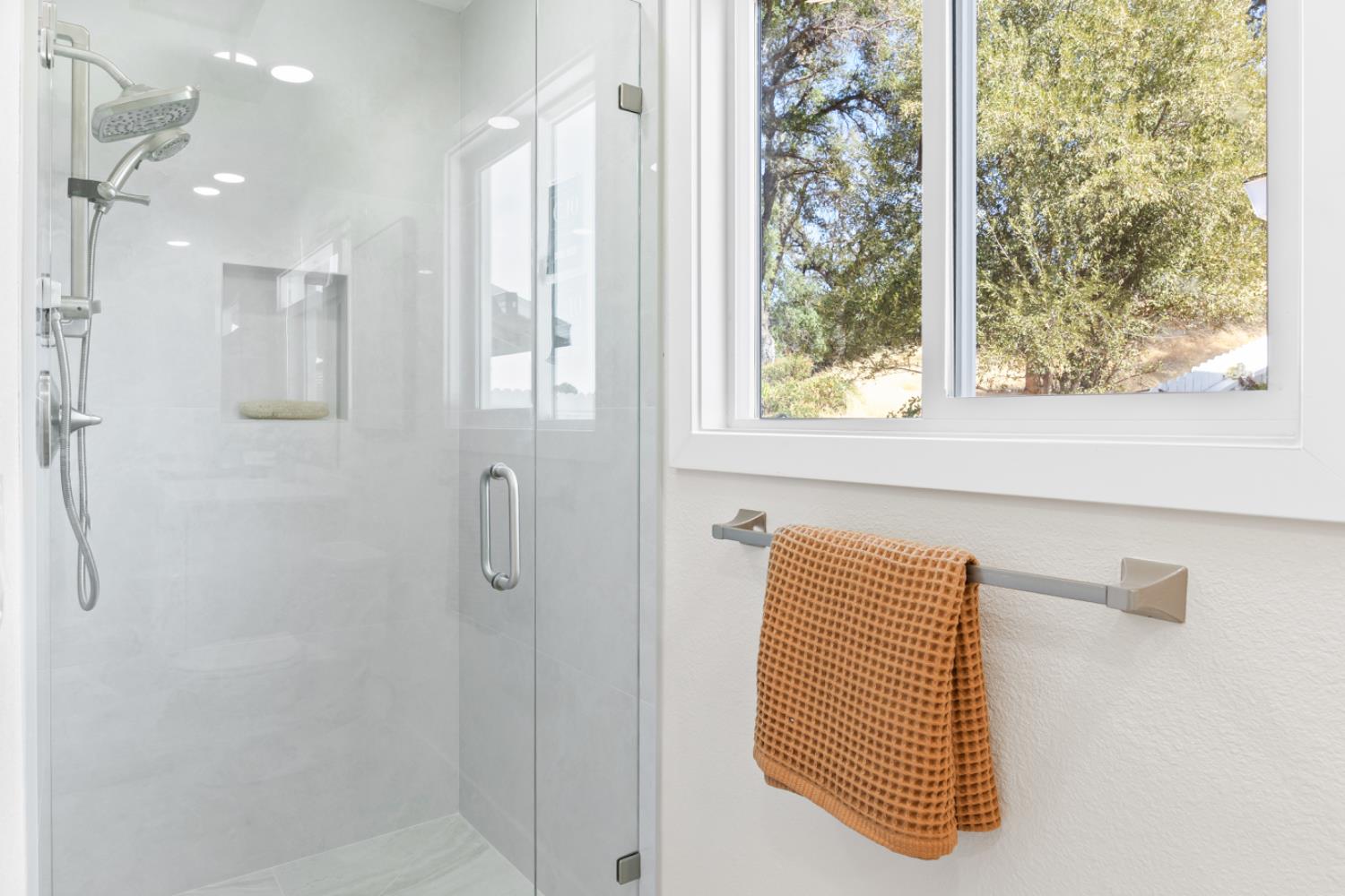 2495 Meadow Creek Road Lincoln, CA 95648 - Photo 31 of 94 a bathroom with a shower and a shower curtain